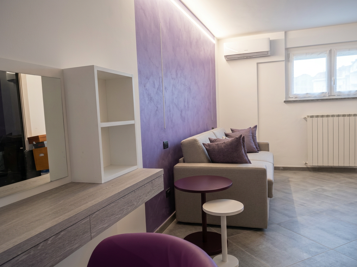 Zona living dell'appartamento con arredi disegnati su misura